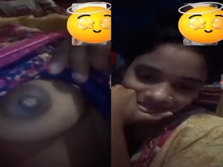 Village girl reveals her natural indian boobs in a call.