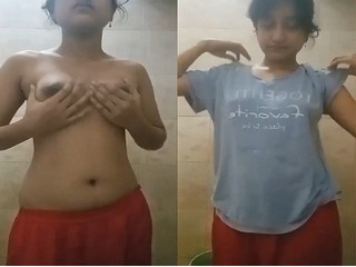Indian girl strips and proudly displays sexy breasts for you.