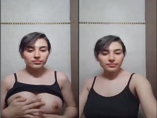 Indian chick flaunting huge breasts for a camera show.