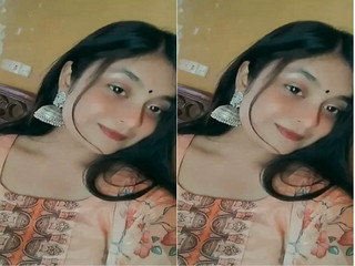 Indian chick flaunting huge breasts for a camera show.