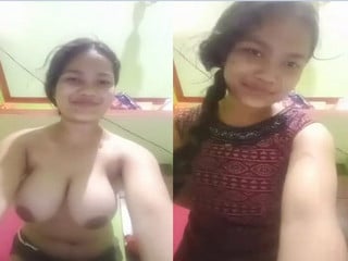 Indian chick flaunting huge breasts for a camera show.