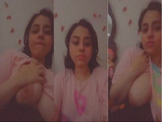 She presses and rubs her massive breasts solo