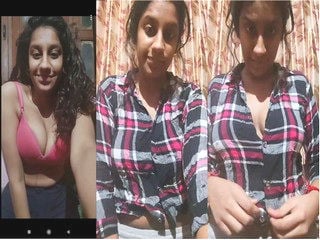 Indian girl strips and proudly displays sexy breasts for you.