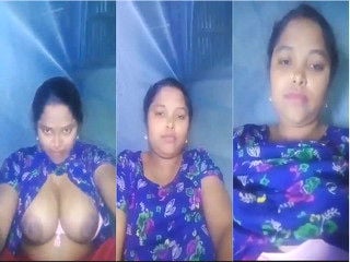 Indian chick flaunting huge breasts for a camera show.