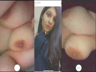 Indian chick flaunting huge breasts for a camera show.