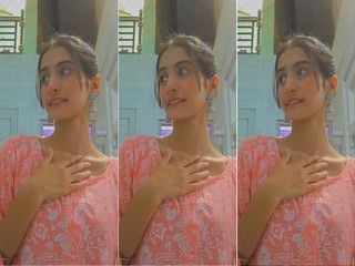 Indian girl strips and proudly displays sexy breasts for you.