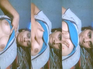 Indian girl strips and proudly displays sexy breasts for you.