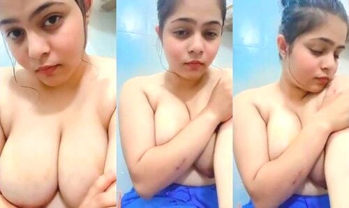 Indian chick flaunting huge breasts for a camera show.