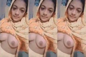 Indian girl strips and proudly displays sexy breasts for you.