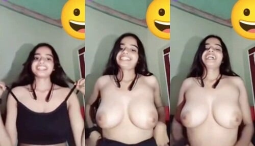 Indian chick flaunting huge breasts for a camera show.