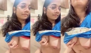 Indian girl strips and proudly displays sexy breasts for you.
