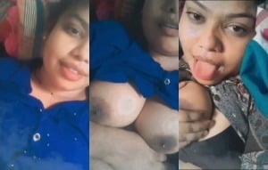 Indian chick flaunting huge breasts for a camera show.