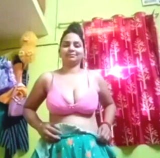 Bihari girl Priya, naked on bed, exploring her pussy with a dildo.
